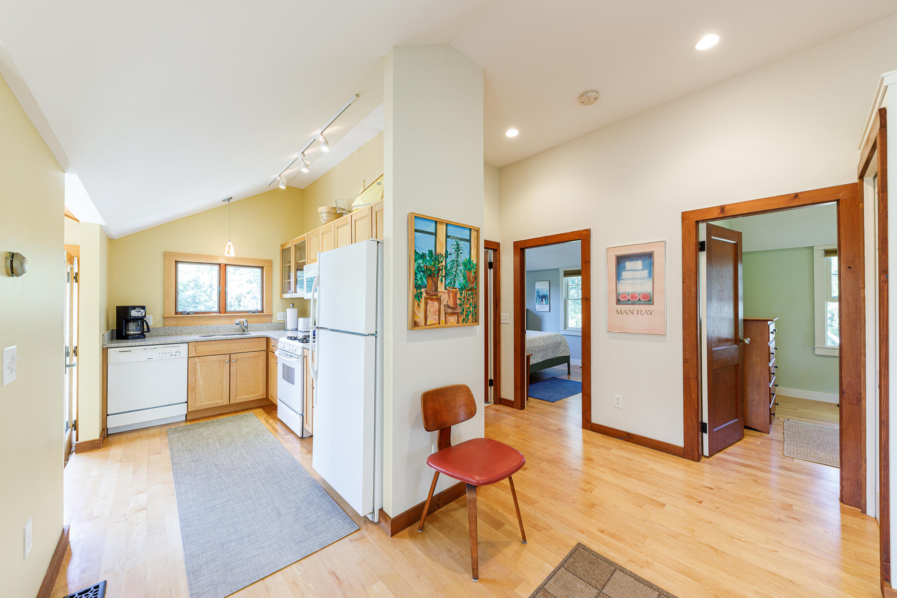295 Mill Road Eastham, MA 02642 - Photo 23 of 33 a view of a living room and kitchen with furniture and wooden floor