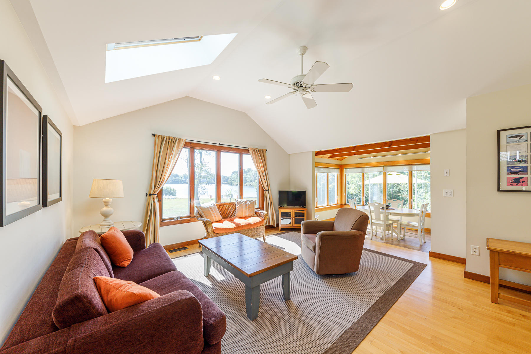 295 Mill Road Eastham, MA 02642 - Photo 24 of 33 a living room with furniture ceiling fan and a window