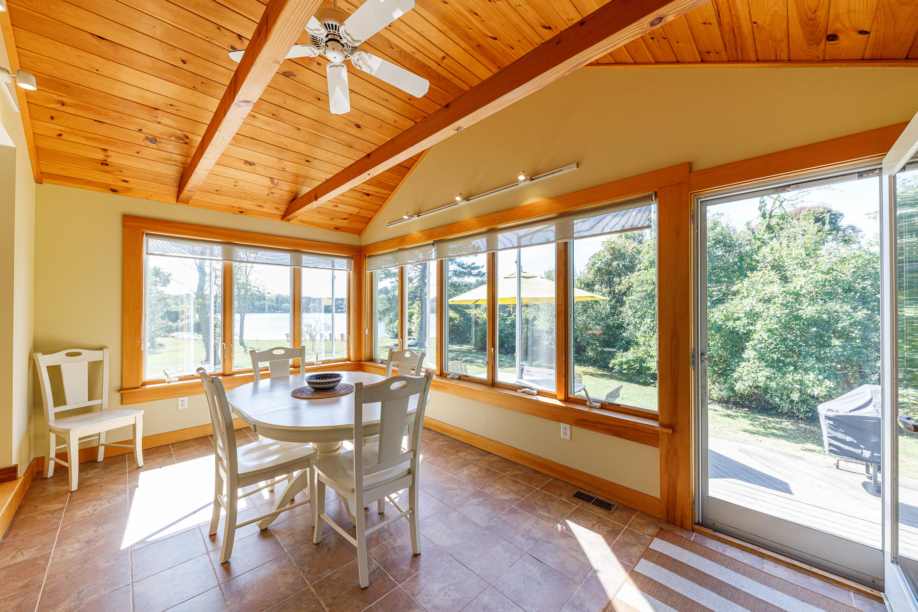 295 Mill Road Eastham, MA 02642 - Photo 25 of 33 a dining room with furniture water view and pool table and chairs