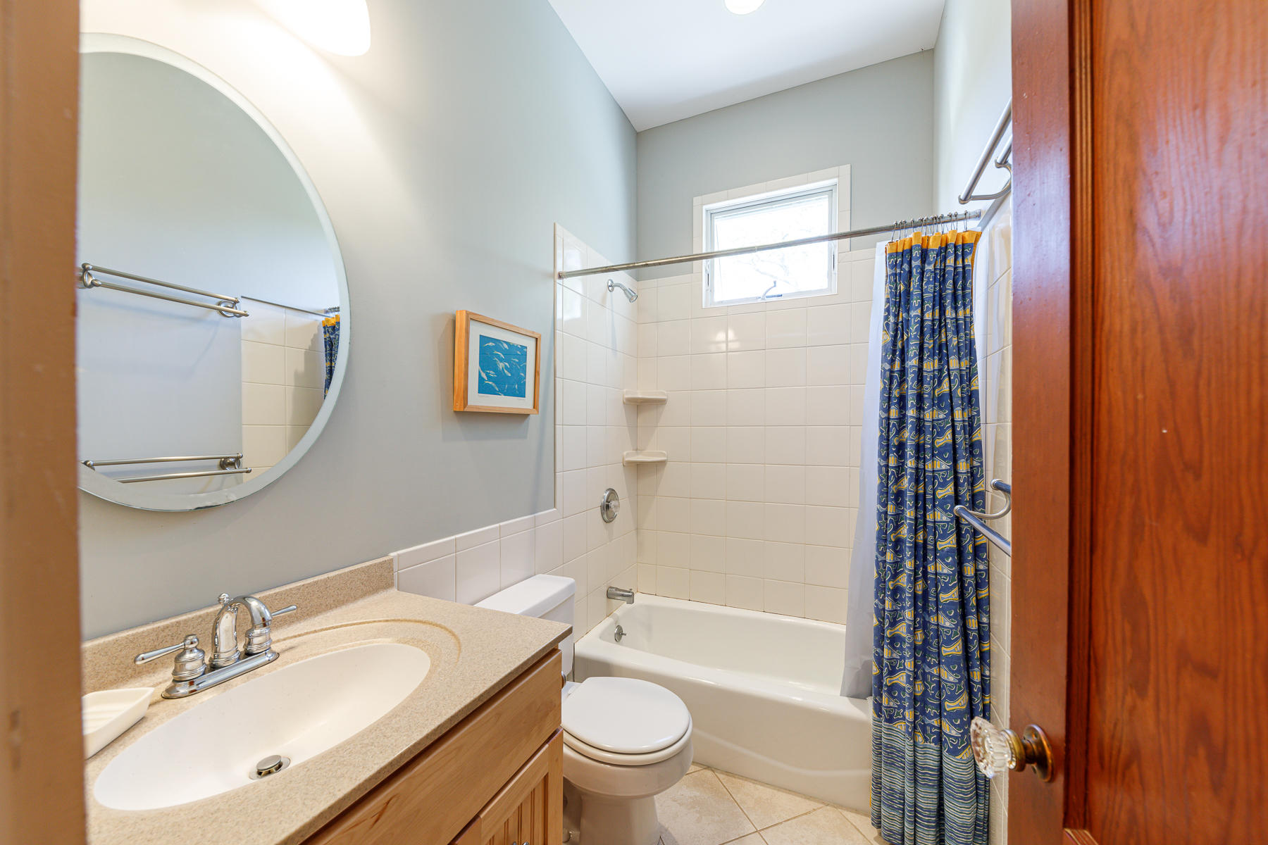 295 Mill Road Eastham, MA 02642 - Photo 27 of 33 a bathroom with a sink a toilet a mirror and shower