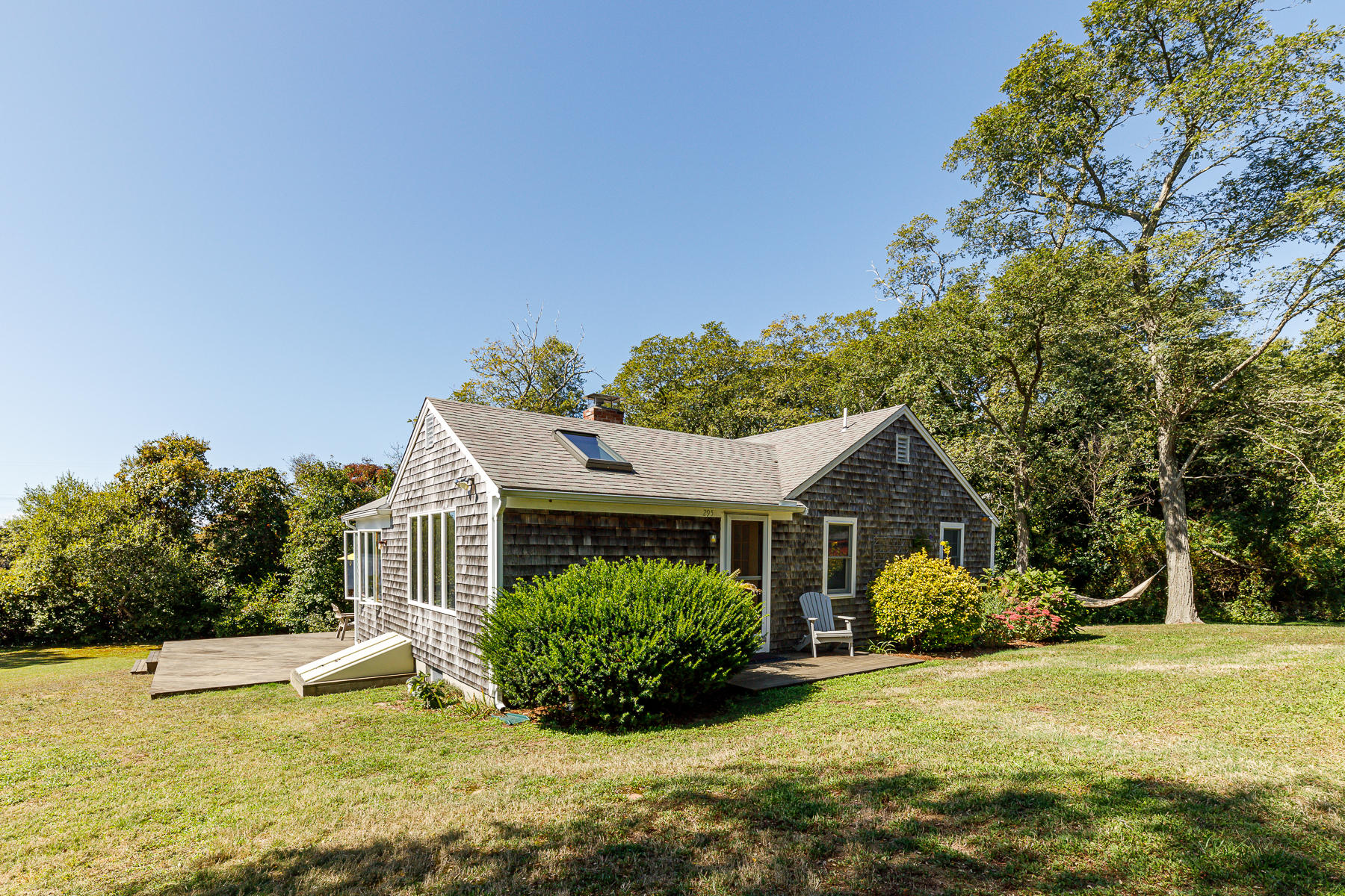 295 Mill Road Eastham, MA 02642 - Photo 31 of 33 a view of a house with a yard
