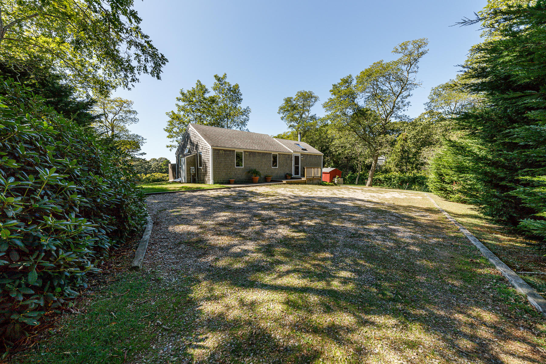 295 Mill Road Eastham, MA 02642 - Photo 33 of 33 a view of a house with a yard