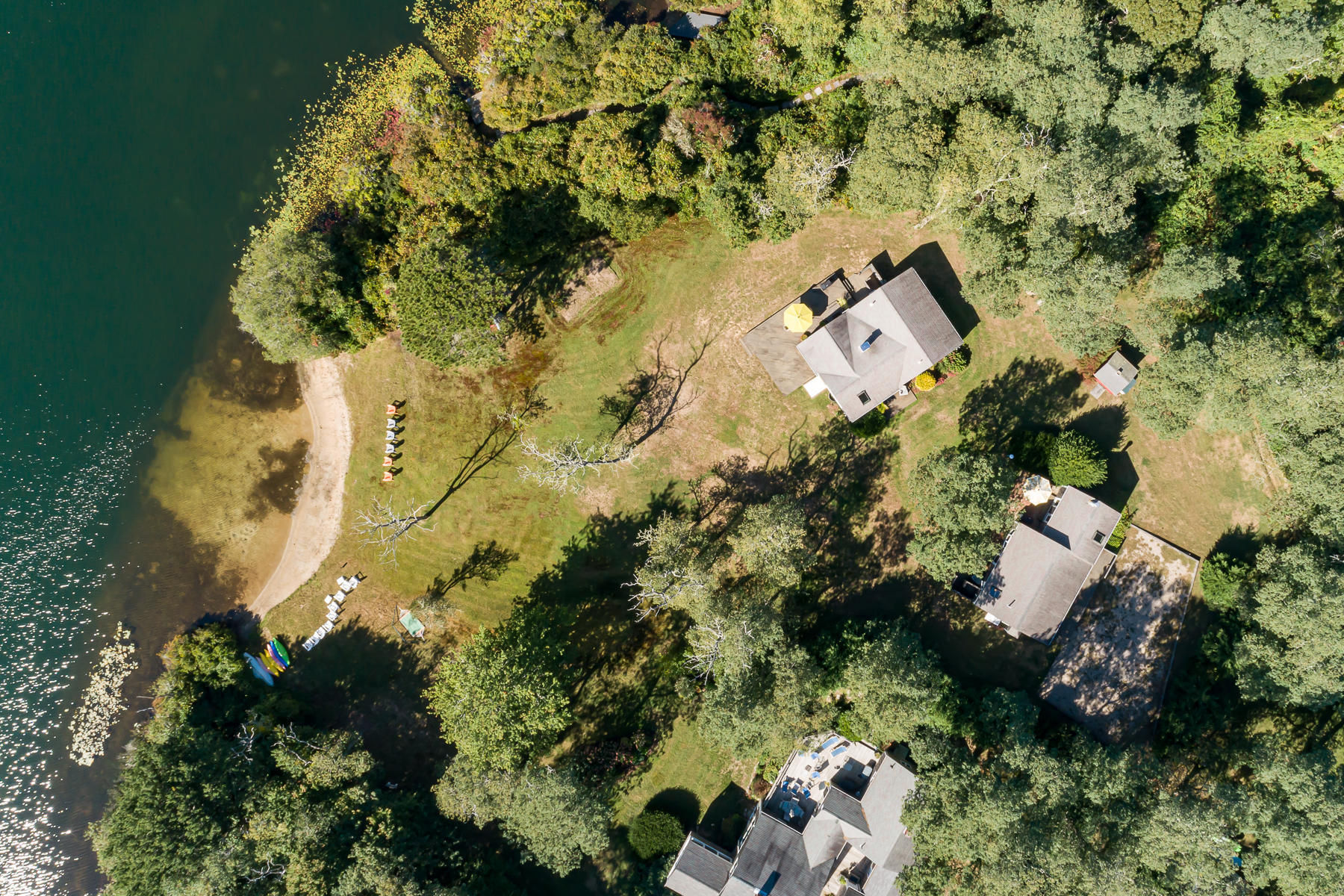 295 Mill Road Eastham, MA 02642 - Photo 6 of 33 an aerial view of a house with a yard and lake view