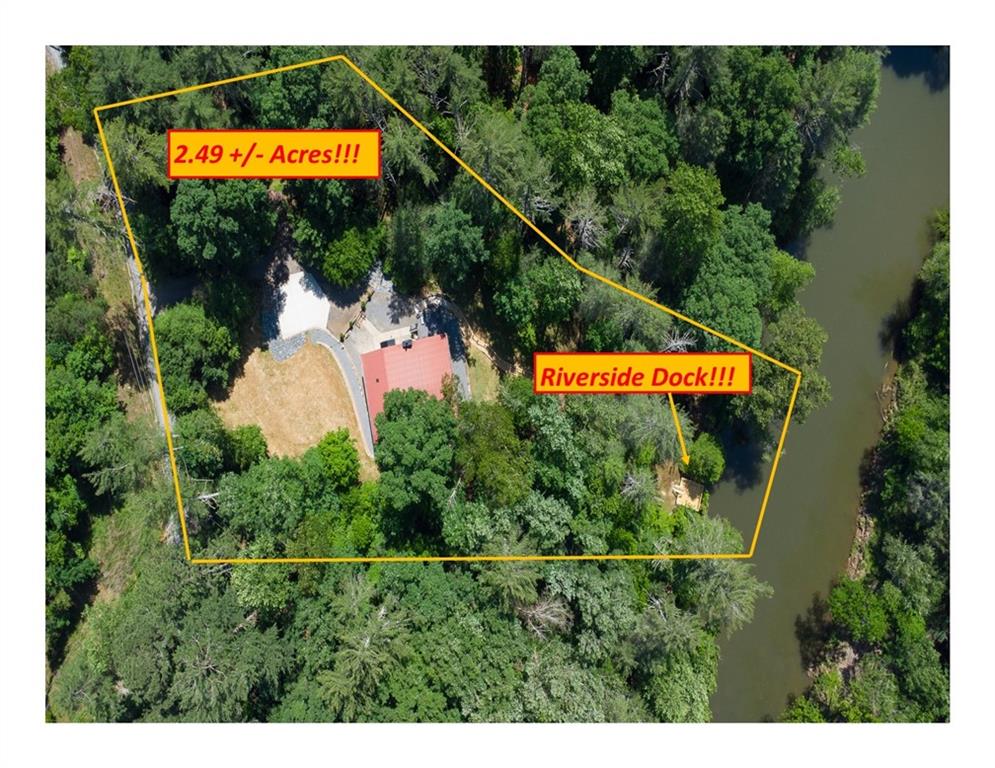 a view of a swimming pool with a yard