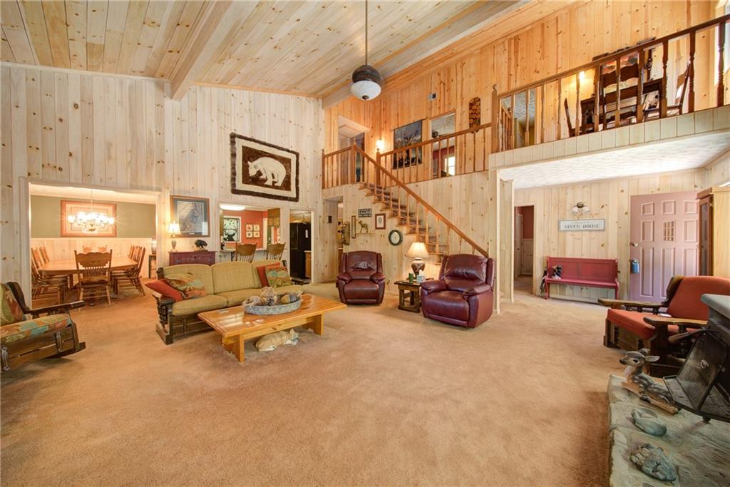 400 Matrix Circle Ellijay, GA 30540 - Photo 11 of 47 a living room with furniture and a chandelier