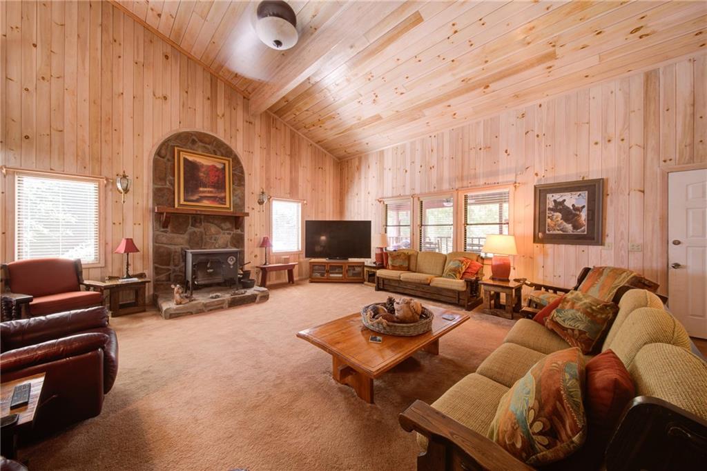 400 Matrix Circle Ellijay, GA 30540 - Photo 14 of 47 a living room with furniture a fireplace and a flat screen tv
