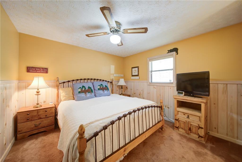 400 Matrix Circle Ellijay, GA 30540 - Photo 22 of 47 a bedroom with a bed and a flat screen tv