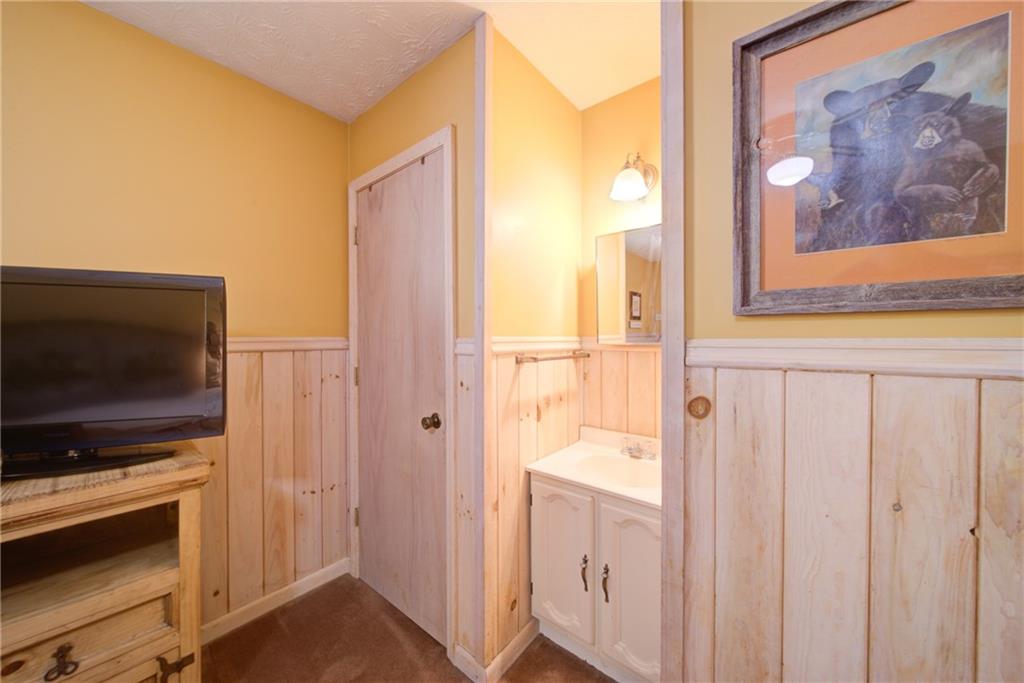 400 Matrix Circle Ellijay, GA 30540 - Photo 23 of 47 a view of a bathroom with a sink and a mirror