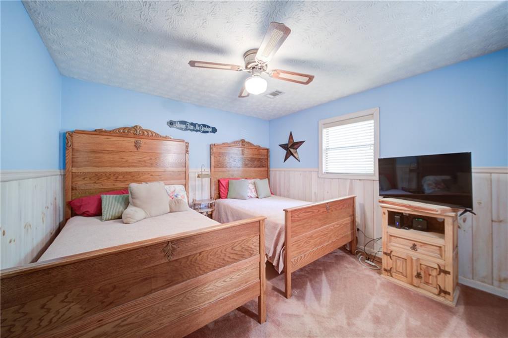 400 Matrix Circle Ellijay, GA 30540 - Photo 29 of 47 a bedroom with furniture and a flat screen tv