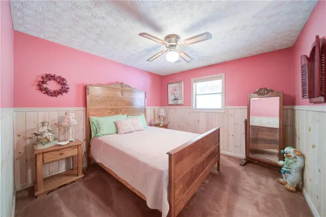 a bedroom with a bed and a closet