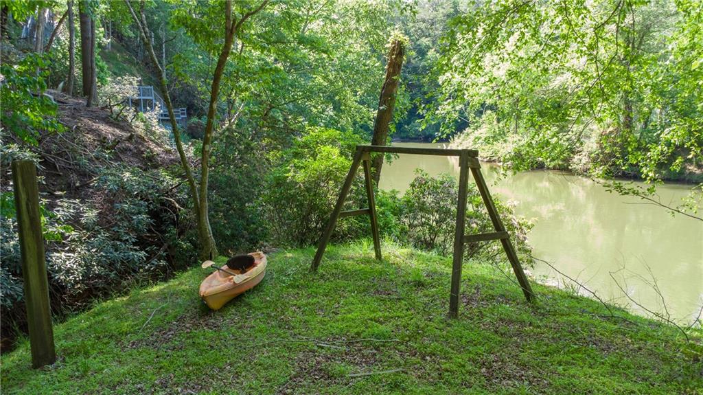 400 Matrix Circle Ellijay, GA 30540 - Photo 42 of 47 a view of a backyard with a bench and plants