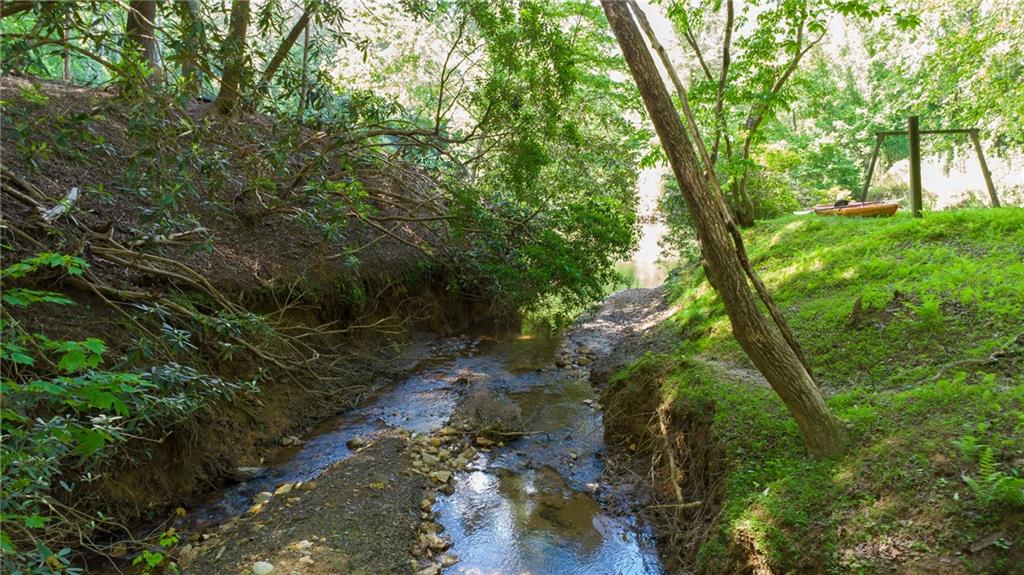 400 Matrix Circle Ellijay, GA 30540 - Photo 44 of 47 a backyard of a house with a yard and outdoor seating