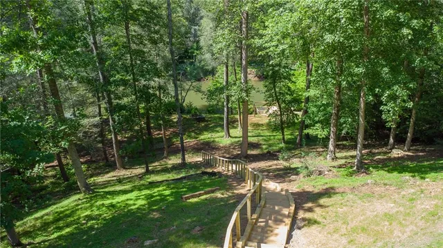 a view of outdoor space with deck and yard
