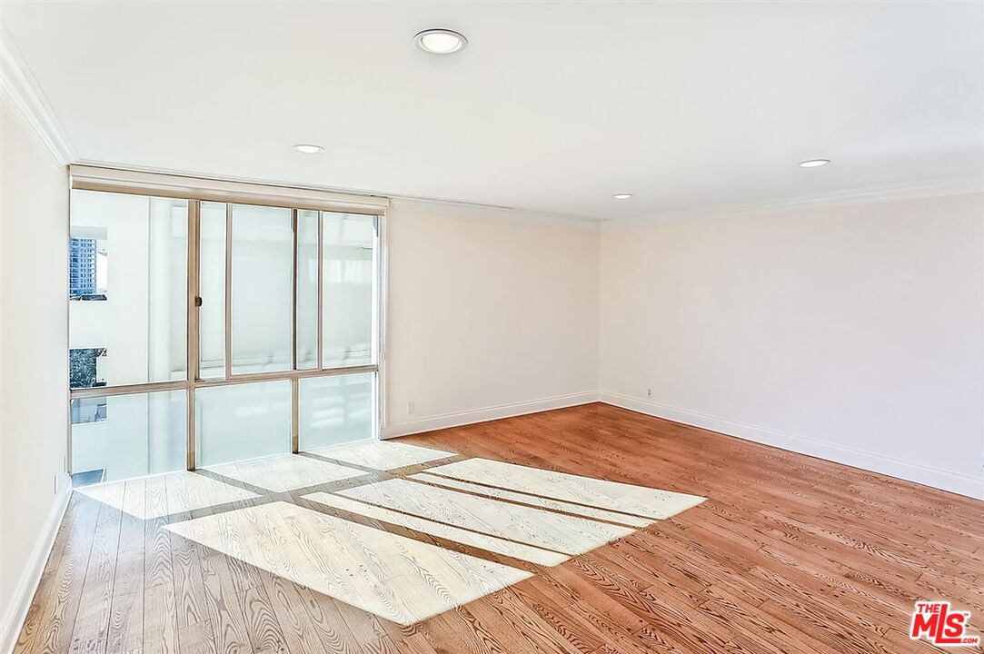 2160 Century Park East, Unit 1903 Los Angeles, CA 90067 - Photo 14 of 40 a view of a room with wooden floor and white walls