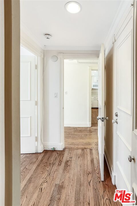 2160 Century Park East, Unit 1903 Los Angeles, CA 90067 - Photo 17 of 40 a view of a room with wooden floor and gate