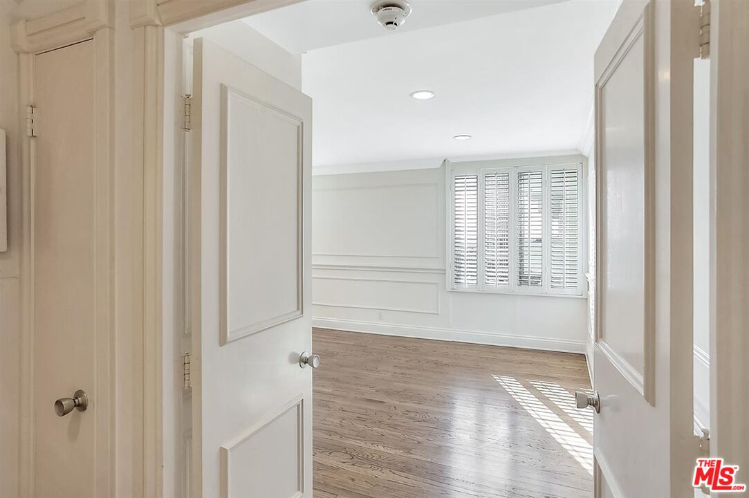 2160 Century Park East, Unit 1903 Los Angeles, CA 90067 - Photo 22 of 40 a view of empty room with wooden floor and fan