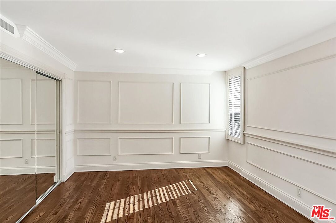 2160 Century Park East, Unit 1903 Los Angeles, CA 90067 - Photo 23 of 40 a view of a room with wooden floor and cabinet