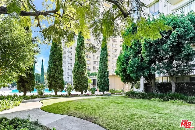 a front view of a building with garden