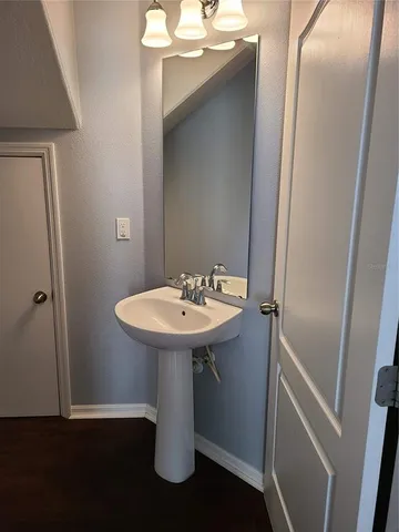 a bathroom with a sink and mirror