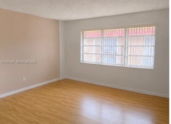5401 Southwest 77th Court, Unit 202E Miami, FL 33155 - Photo 3 of 6 an empty room with a window
