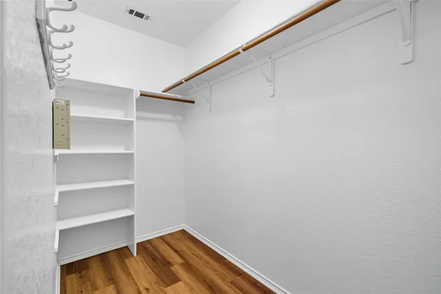 a view of a room with shelf on the wall