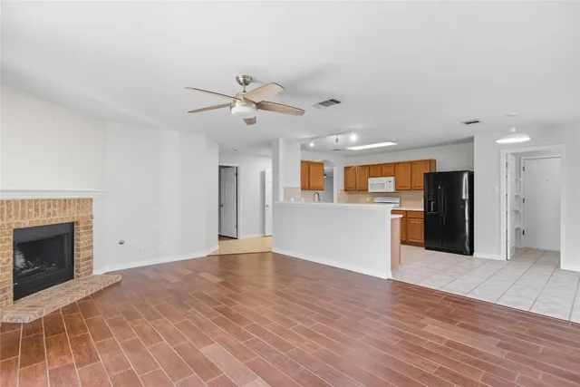 a view of a kitchen with a sink and a fireplace