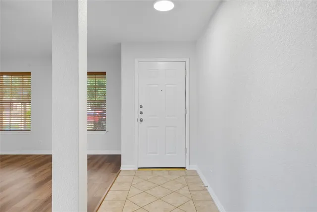 a view of an empty room and window