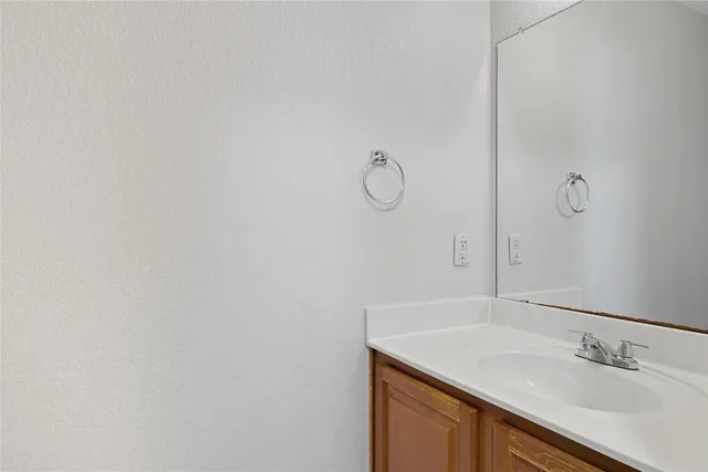 a bathroom with a sink and vanity
