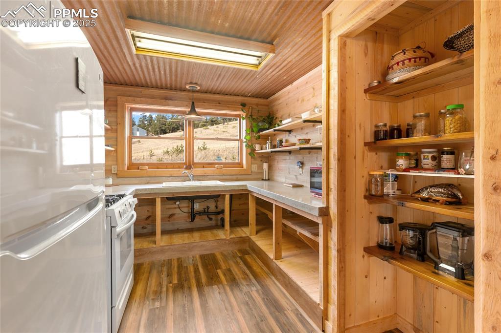 795 South Mountain Estates Road Florissant, CO 80816 - Photo 11 of 42 a view of a kitchen with a large window