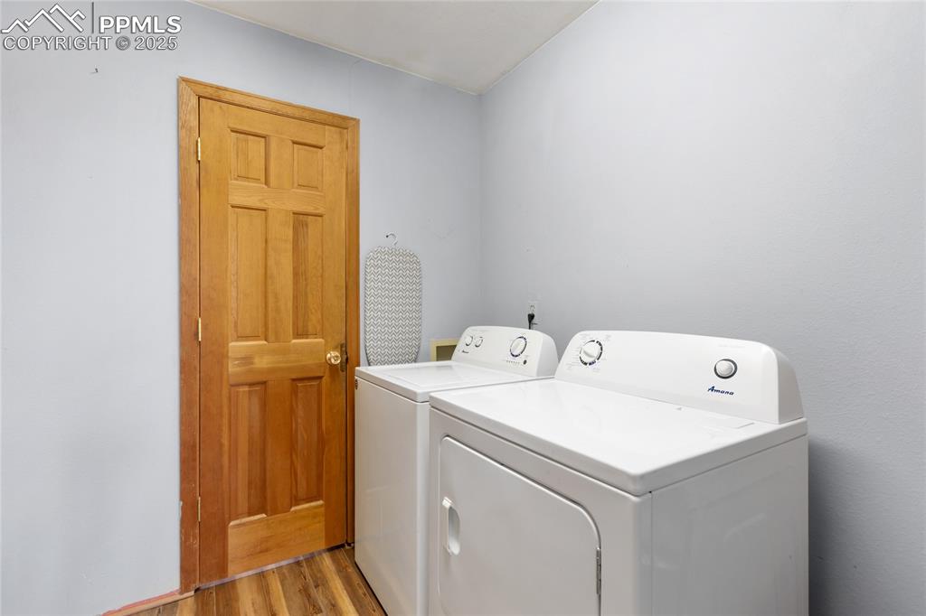 795 South Mountain Estates Road Florissant, CO 80816 - Photo 29 of 42 a utility room with dryer and washer