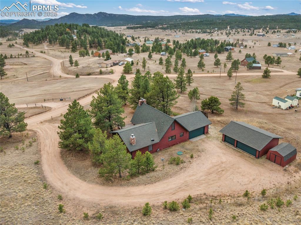 795 South Mountain Estates Road Florissant, CO 80816 - Photo 36 of 42 an aerial view of a house with a yard and lake view