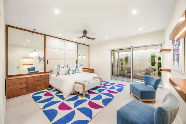 a very nice looking bedroom with a large window