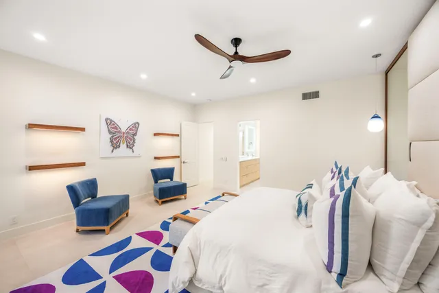 a bedroom with a bed and a couch