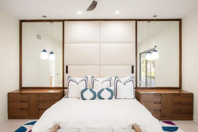 a bedroom with a bed and a dresser