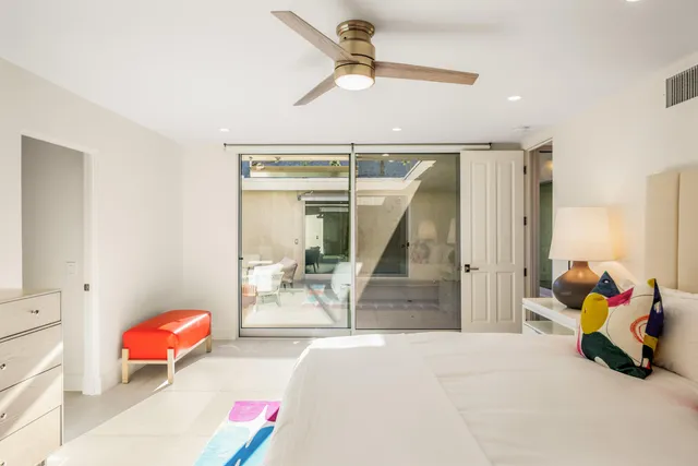 a bedroom with a bed and a couch