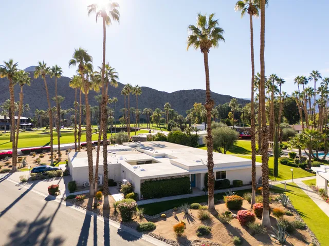 a view of a swimming pool with a lounge chairs