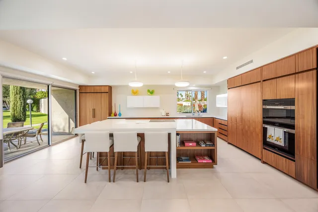 a kitchen with a table and chairs