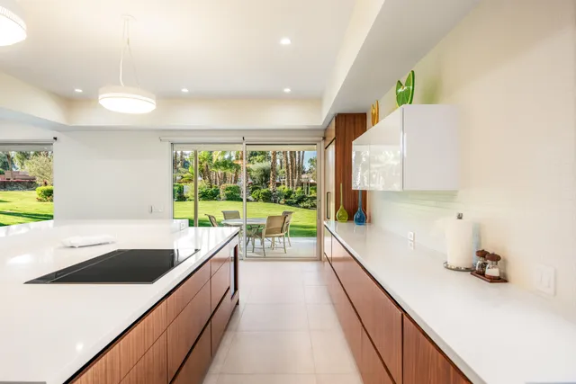 a view of a kitchen with a large window