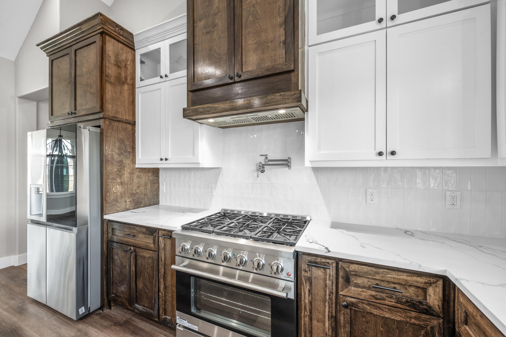 93 Longhorn Loop New Waverly, TX 77358 - Photo 14 of 47 a kitchen with stainless steel appliances granite countertop a stove and a refrigerator