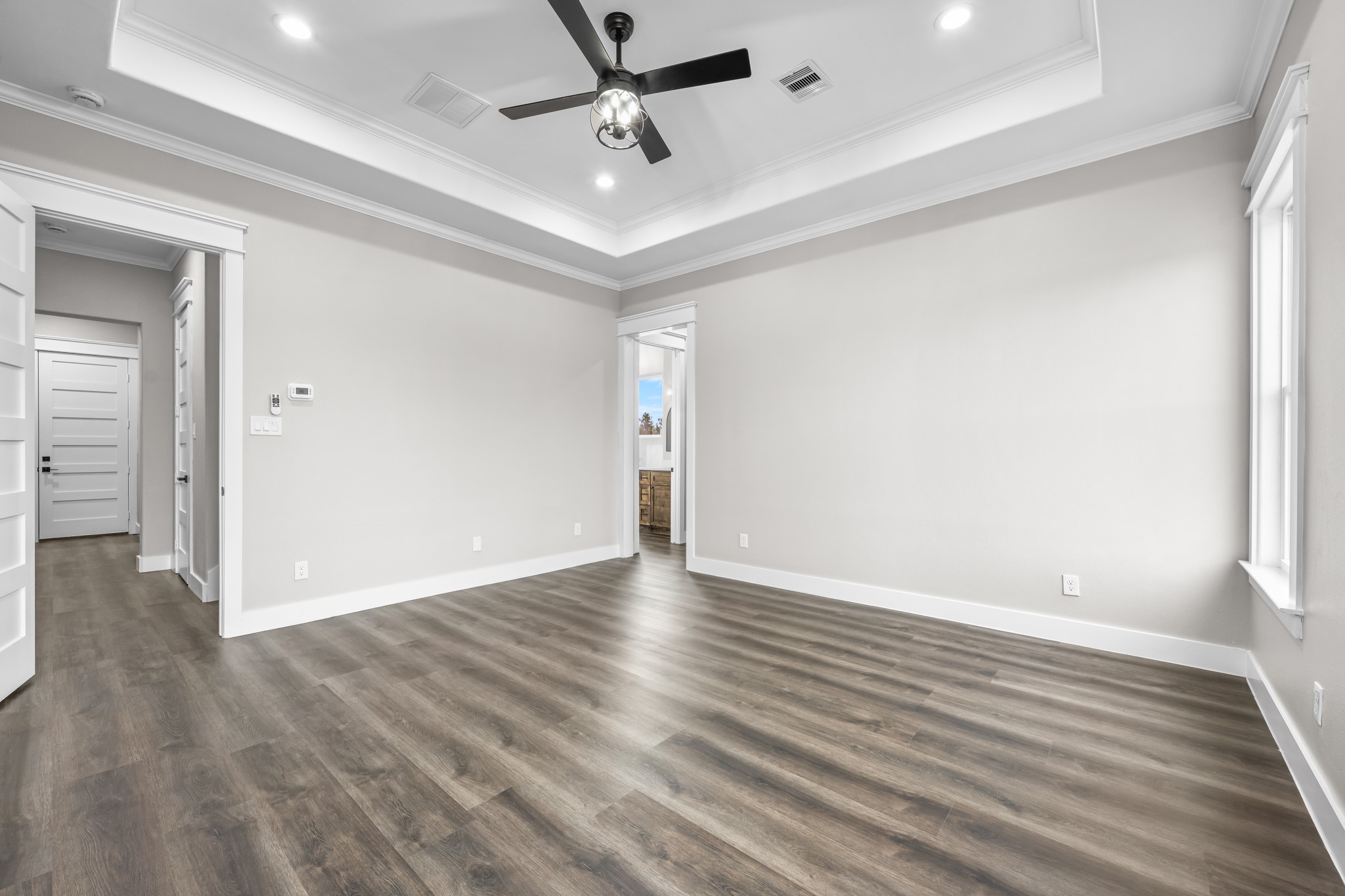 93 Longhorn Loop New Waverly, TX 77358 - Photo 20 of 47 a view of an empty room with wooden floor