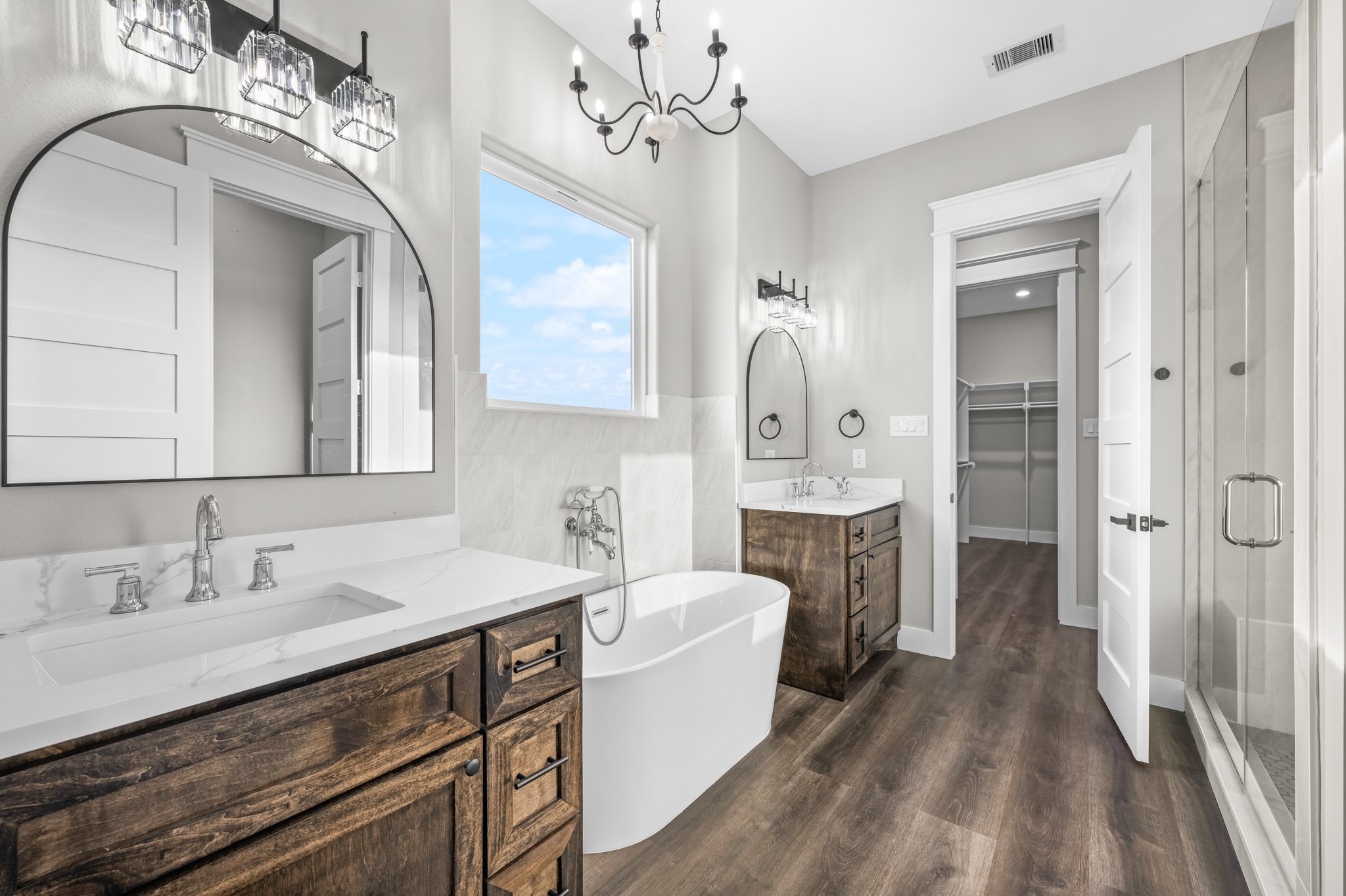 93 Longhorn Loop New Waverly, TX 77358 - Photo 21 of 47 a spacious bathroom with a double vanity sink a mirror and shower