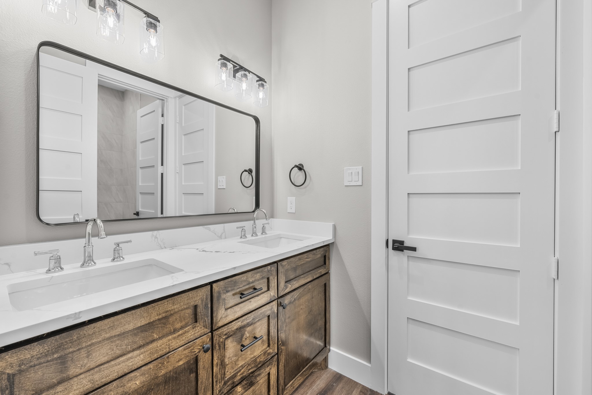 93 Longhorn Loop New Waverly, TX 77358 - Photo 24 of 47 a bathroom with a granite countertop sink and a mirror