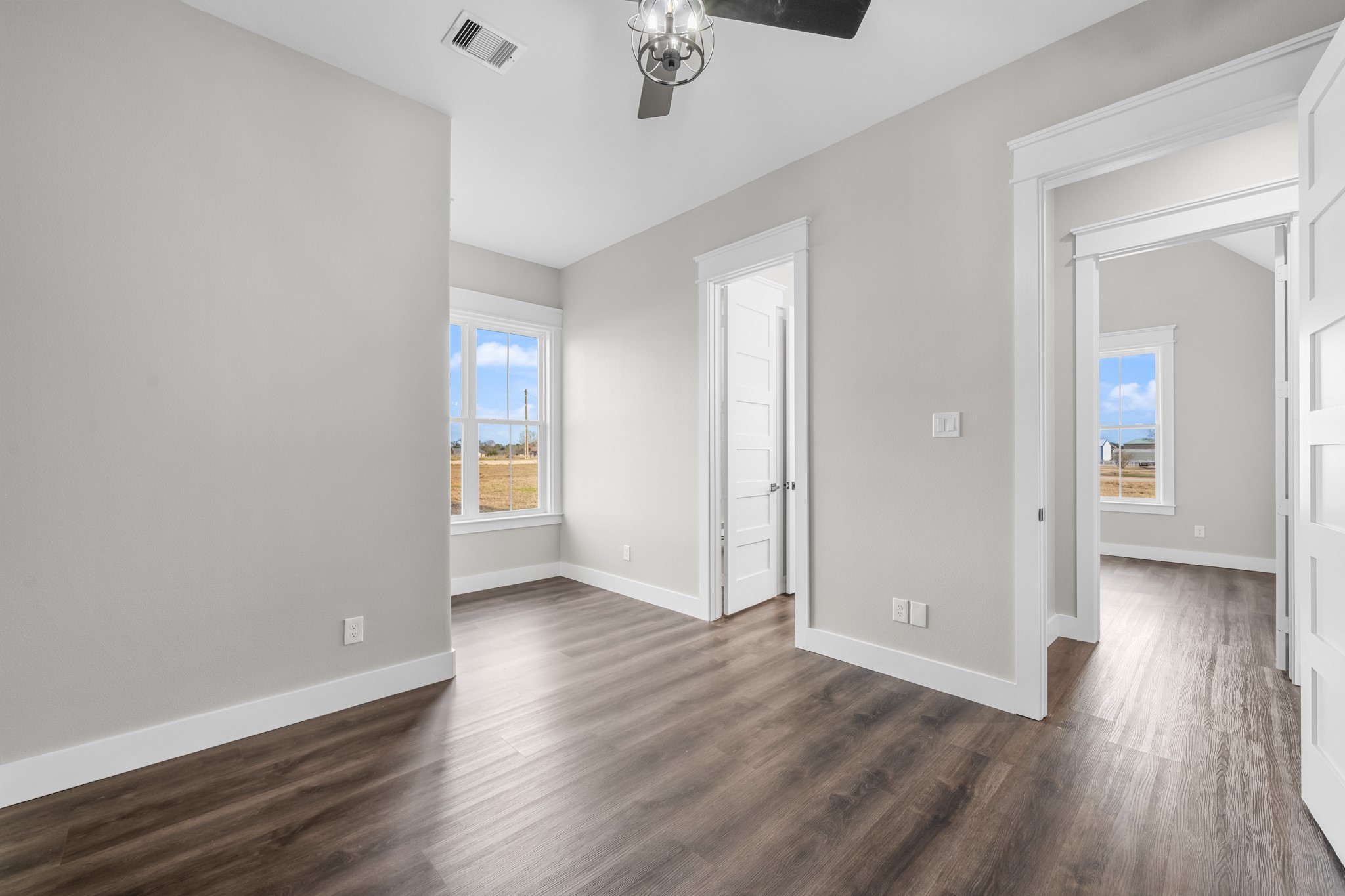 93 Longhorn Loop New Waverly, TX 77358 - Photo 25 of 47 wooden floor in an empty room with a window