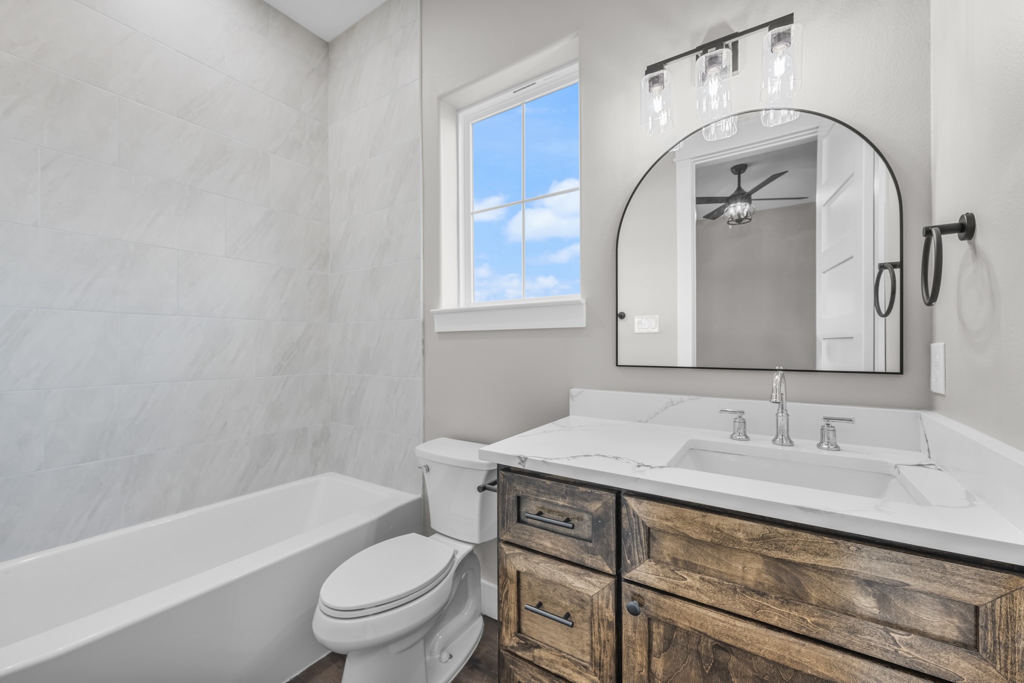 93 Longhorn Loop New Waverly, TX 77358 - Photo 27 of 47 a bathroom with a toilet a sink and bathtub