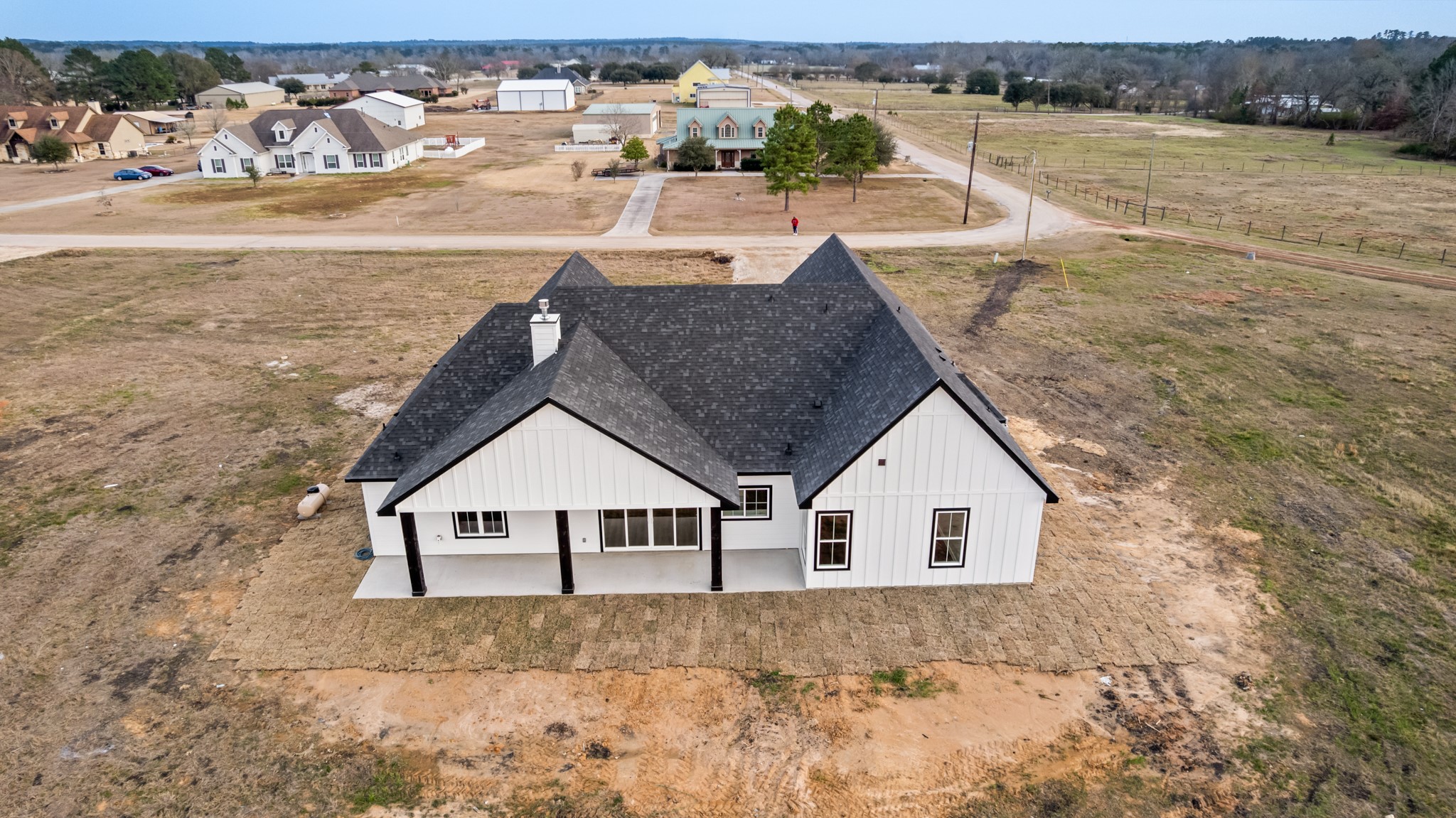 93 Longhorn Loop New Waverly, TX 77358 - Photo 36 of 47 a view of a terrace with wooden floor and lake view
