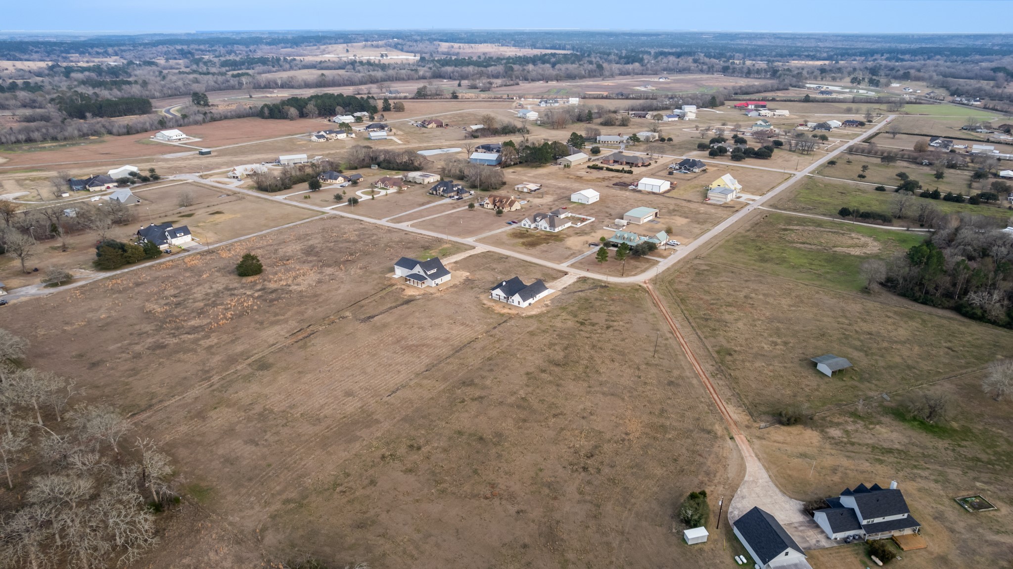 93 Longhorn Loop New Waverly, TX 77358 - Photo 41 of 47 an aerial view of residential houses with outdoor space
