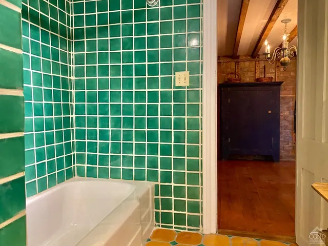 a view of a bathroom with tub