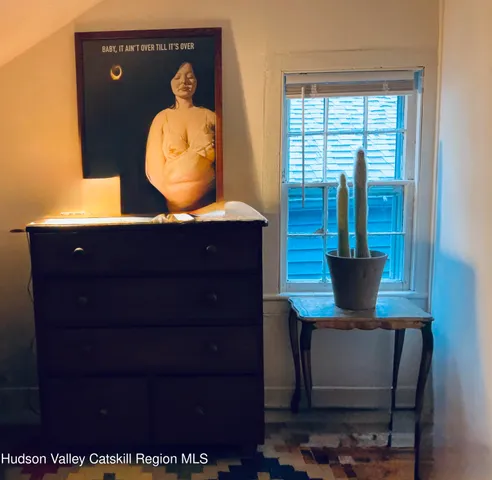 a view of a wooden table and chairs in the room