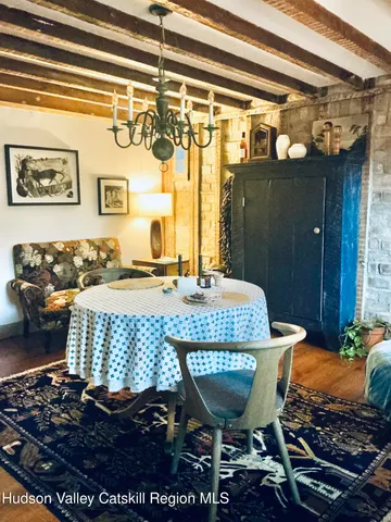 a view of a patio with table and chairs
