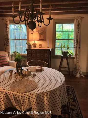 a bed sitting in a room next to a window